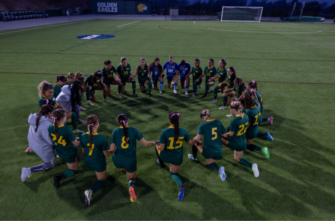  The Lady Golden Eagles circled up in prayer before a match. 